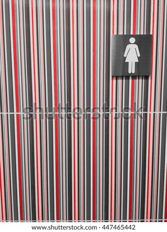 Woman toilet sign  with rainbow background