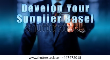 Corporate manager is pushing Develop Your Supplier Base! on a virtual screen. Business objectives concept, motivational metaphor and call to action. Close up torso shot of man in blue suit.