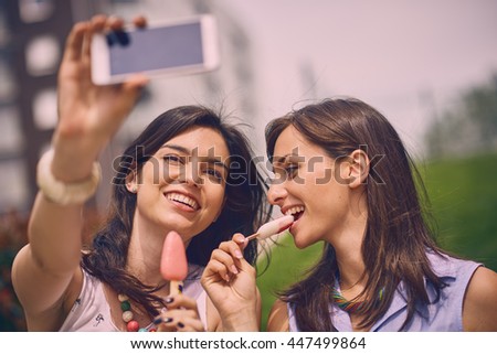 Two Girls making selfie Outdoors