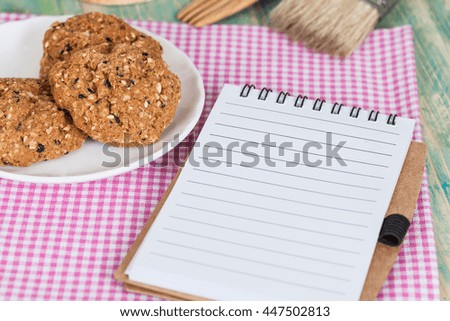 whole Grain cookie with note book On Wood table