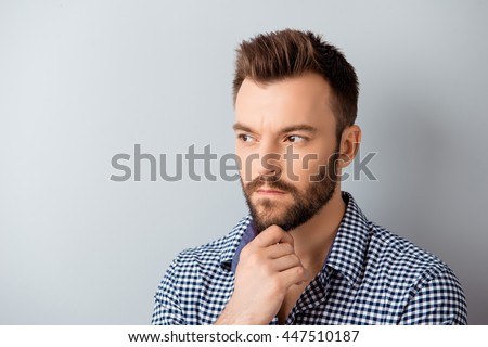Handsome ponder bearded guy dreaming about future job
