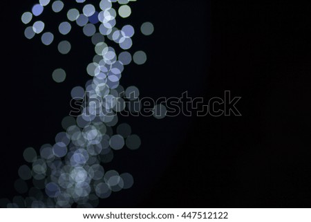 The white circles, bokeh on black abstract background