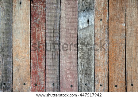 Colorful paint on wooden background. Rustic wallpaper