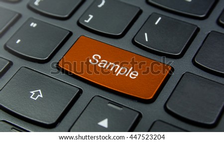 Business Concept: Close-up the Sample button on the keyboard and have Orange color button isolate black keyboard