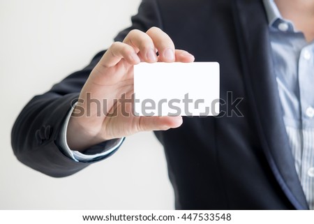 man holding white business card - for write the message in card Royalty-Free Stock Photo #447533548