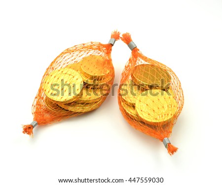 chocolate coin gold in mesh bags on white background. Royalty-Free Stock Photo #447559030