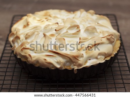 Lemon meringue pie on a cooling rack