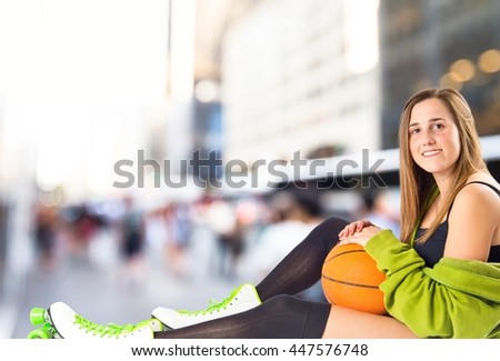 Pretty young girl wearing urban style with roller-skates on unfocused background