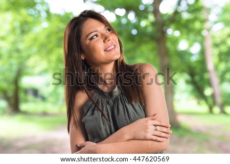 Young girl thinking in the park