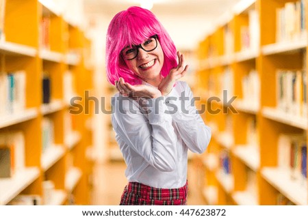 Girl with pink hair  on unfocused background