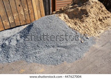 Two piles of gravel and sand at industrial site. Building materials on the construction site. 