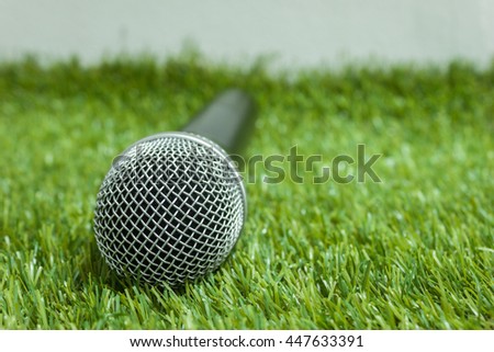 Microphone on green grass