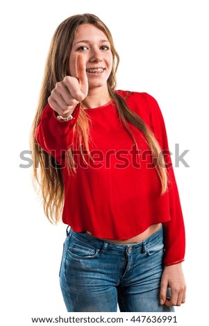 Teen girl with thumb up