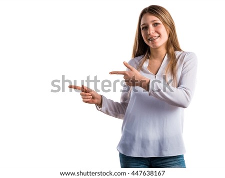 Teen girl pointing to the lateral