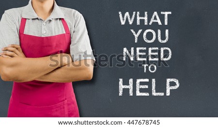 cropped of shopman with arms crossed isolated over a blackboard background with text what you need to help