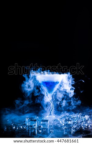 blue cocktail with dry ice vapor