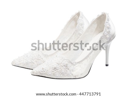 White bridal wedding shoes (footwear) isolated on white background. Clipping path inside. Royalty-Free Stock Photo #447713791