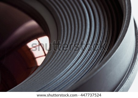 Objective lens with reflections of light sources closeup