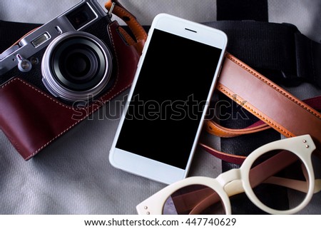 smart phone blank screen on bag  and camera vintage
