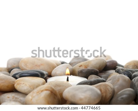 candle  in stones isolated on white background