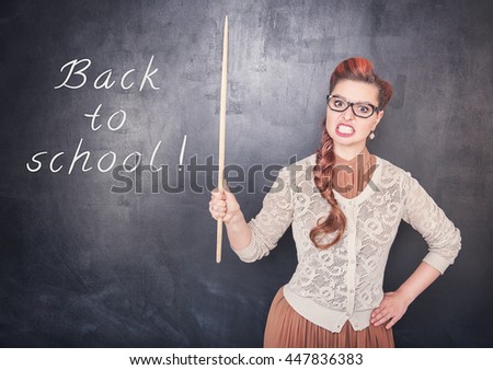 Angry teacher with pointer on the chalkboard blackboard background