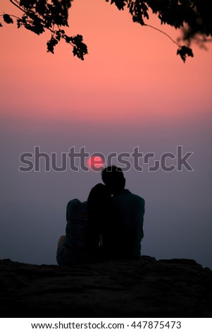 Female and male lover romantic at sunset silhouette picture