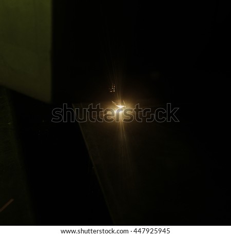 bright sparks of metal against dark background
background picture out of focus, small depth of field