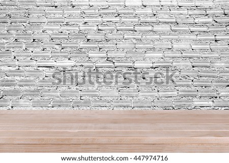 brown wood table top on white concrete wall background - can be used for montage or display your products 