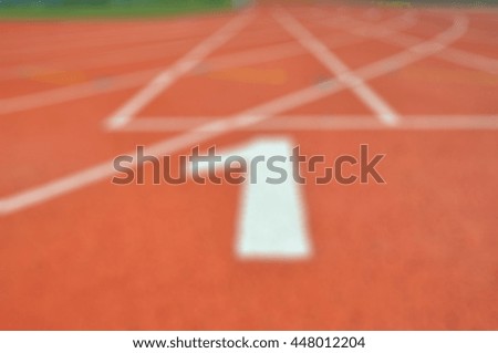 Defocus athletic track lane number.