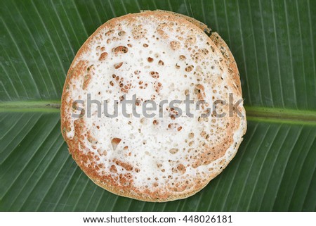 Appam/Palappam/Kallappam/vella appam/plain hoppers, a popular traditional Kerala breakfast bread on a houseboat, Alappuzha, India. South Indian food.