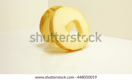 Yellow juicy melon. Isolated on white background.