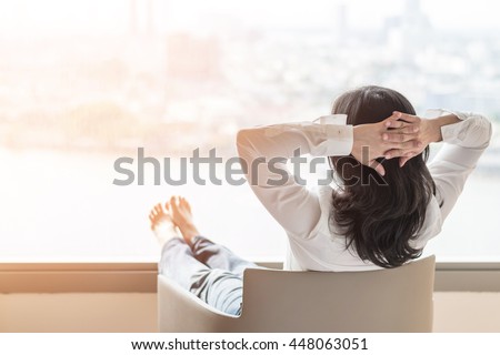 Life-work balance concept with woman take it easy or resting in hotel or home living room interior Royalty-Free Stock Photo #448063051