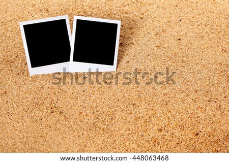 Summer holiday instant camera photo frame prints on a beach sand background