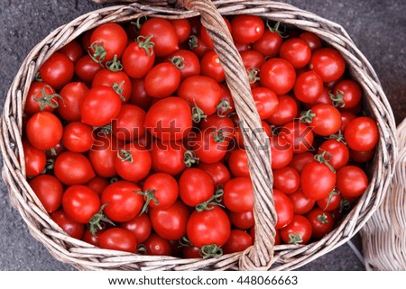 Red tomatoes in basket. Top view, High resolution product.