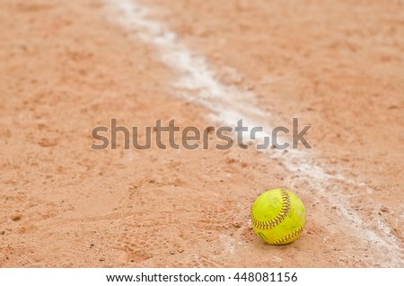 old softball in field,old softball in play,play softball
