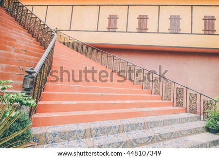 Orange pastel Stair in cintage village. Image is vintage effect and low light photo