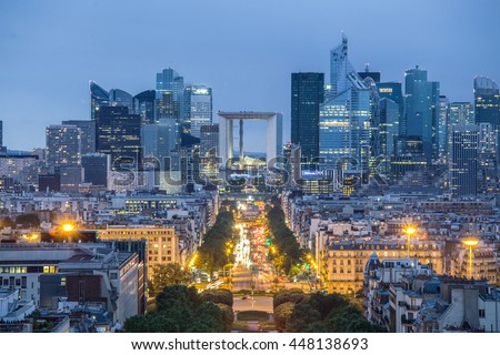 View of La Defence Paris business district from Place Charles De Gaulle at dusk.