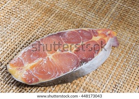 pieces of Spanish Mackerel on wood board