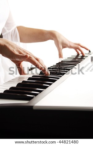 Beautiful bride playing piano