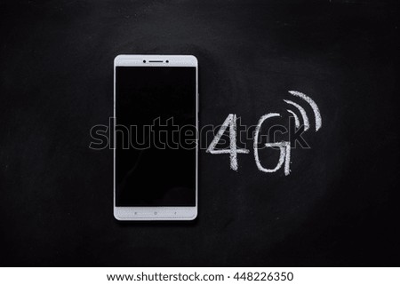 Smart phones and 4g signals placed on the blackboard