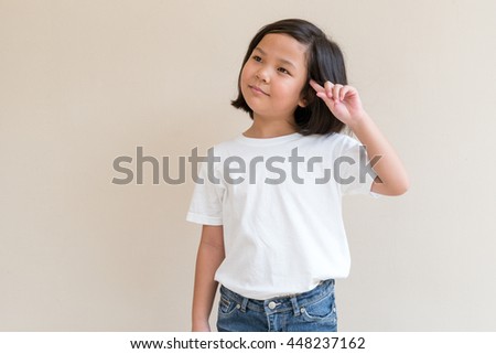Portrait of asian little girl smiling and thinking. Portrait of asian girl smiling for inspiration concept ideas. Thailand
