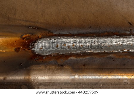 welding seam onto steel sheet metal Industrial steel welder in factory