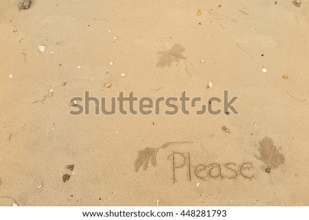 written words "Please" on sand of beach