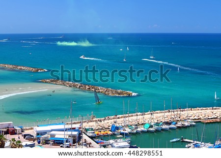 Distance view on blue beautiful water area of Tel Aviv coast. Yachting and boating seascape. Marina mole. Sports and recreation. Mediterranean, Israel