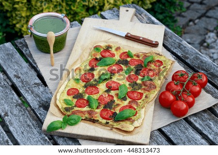 Pizza with tomato and basil