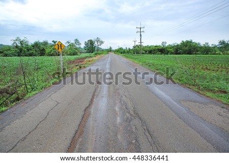 Damaged road in thailand countryside, Rainy season