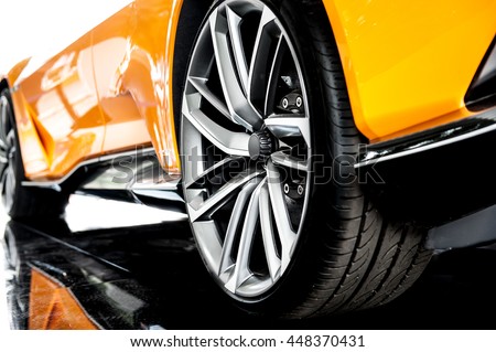 Back of an orange modern sport car Royalty-Free Stock Photo #448370431