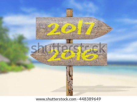 Wooden direction sign with 2017 and 2016