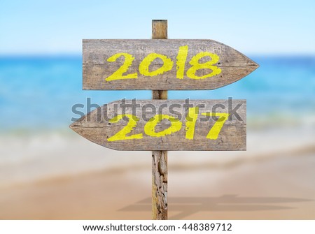 Wooden direction sign with 2017 and 2018