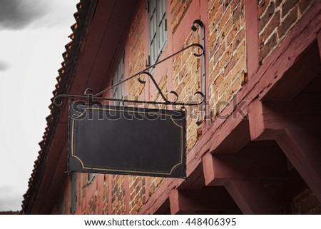 Image of a vntage sign on an old building.